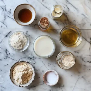 Tigernut Flour Pancakes (Gluten-Free, AIP, and High-Protein Recipe) 7 All ingredients for tigernut flour pancakes laid out on a wooden counter